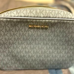 Brand new michael kors crossbody bag in safiano leather blue & gold chain.